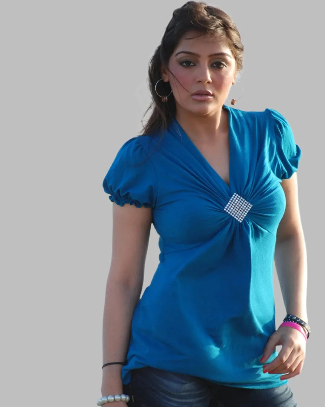 Turquoise cap sleeve knit top with brooch