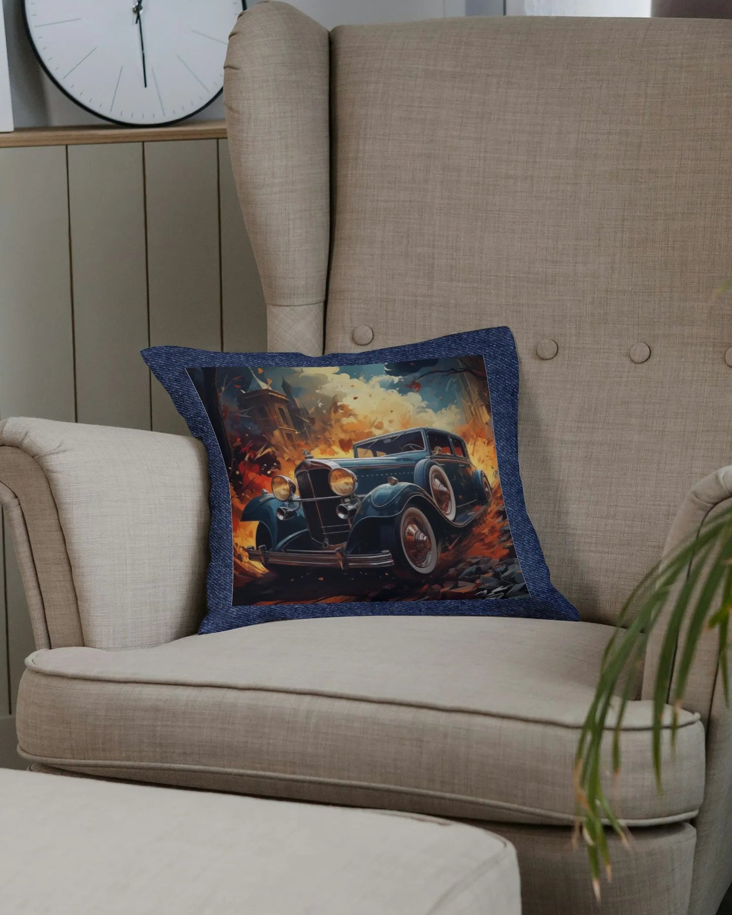 Beige armchair with a decorative pillow featuring a vintage car design, surrounded by plants and a clock on a wooden panel wall.