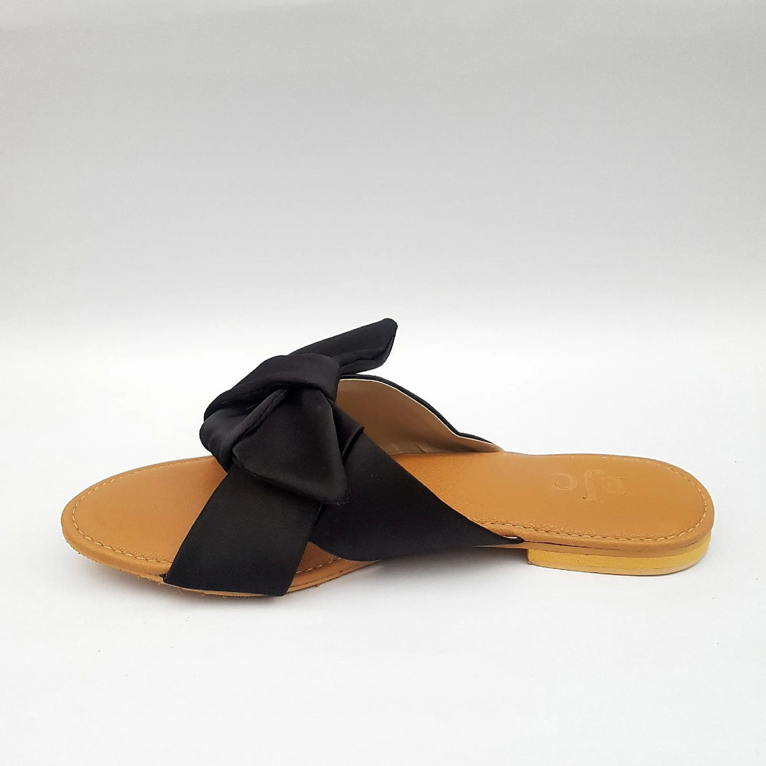 Slip on Sandals with black velvet bow and tan Sole