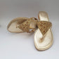 Golden flat slippers with stone embellishment