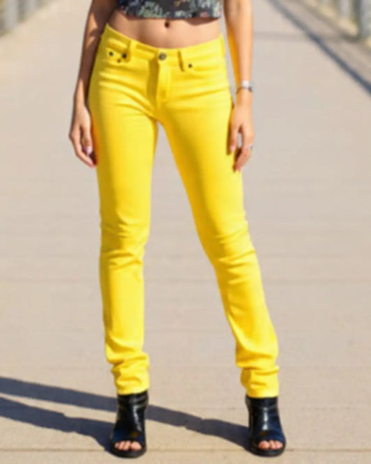 Person wearing bright yellow pants on a neutral background
