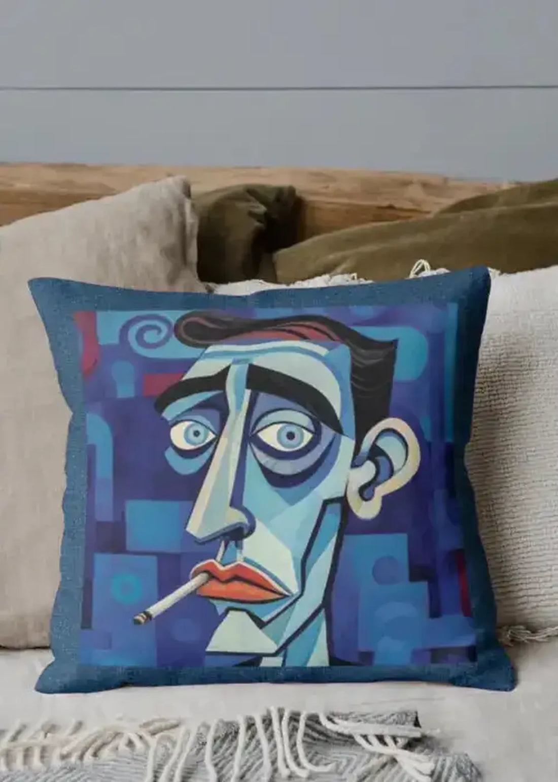 Decorative pillow with a stylized face design on a couch