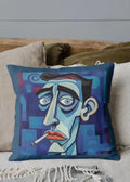 Decorative pillow with a stylized face design on a couch