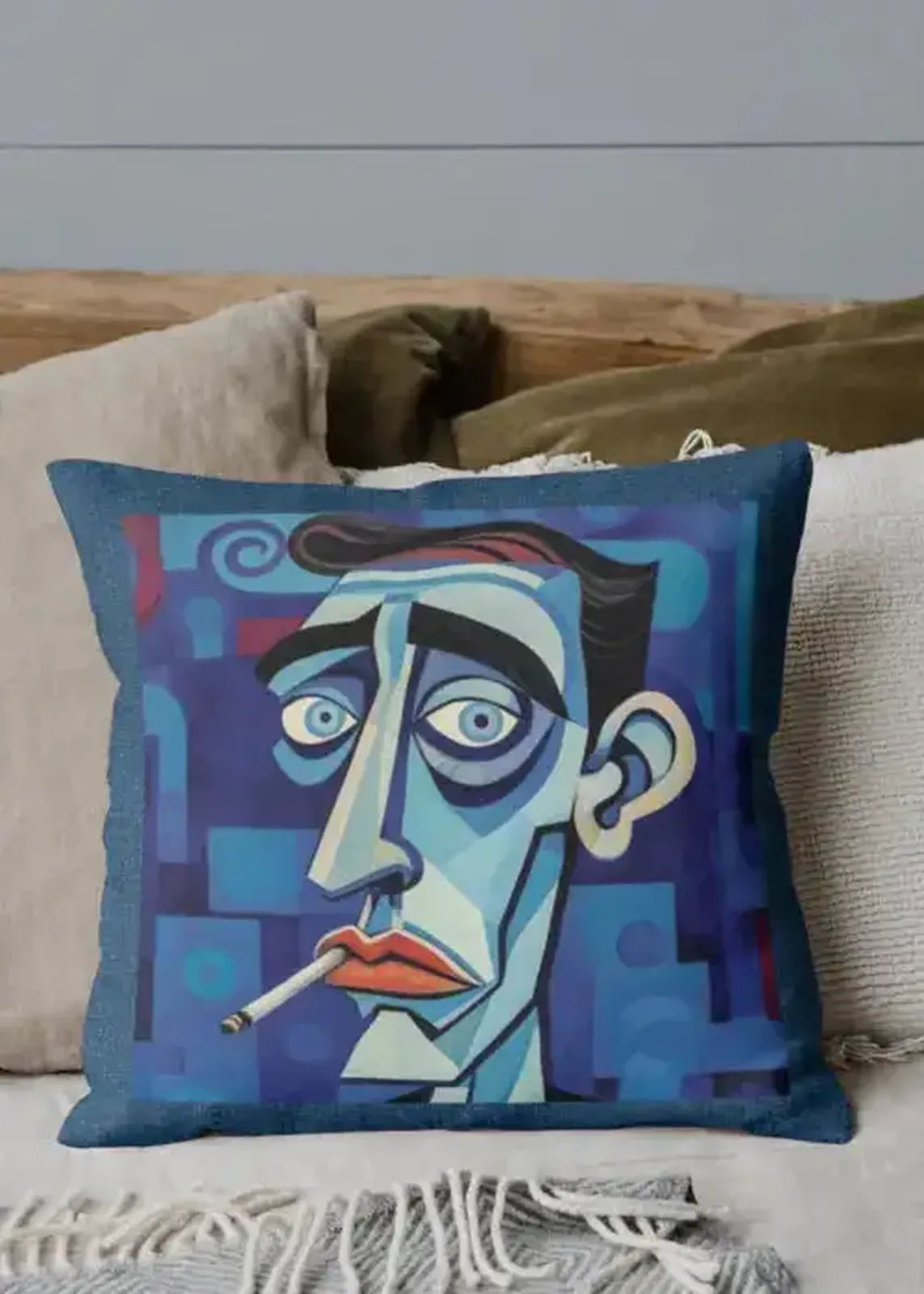 Decorative pillow with a stylized face design on a couch