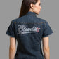 Woman wearing a denim jacket with 'Element' branding on a plain background