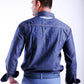 Man wearing a blue denim jacket and pants on a white background