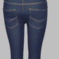 Navy blue jeans on a gray background