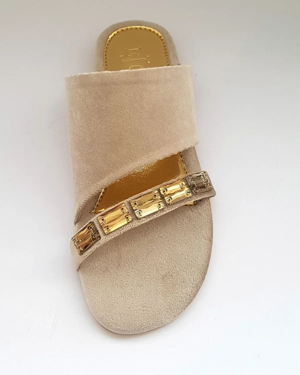 Beige sandal with gold embellishments on a white background