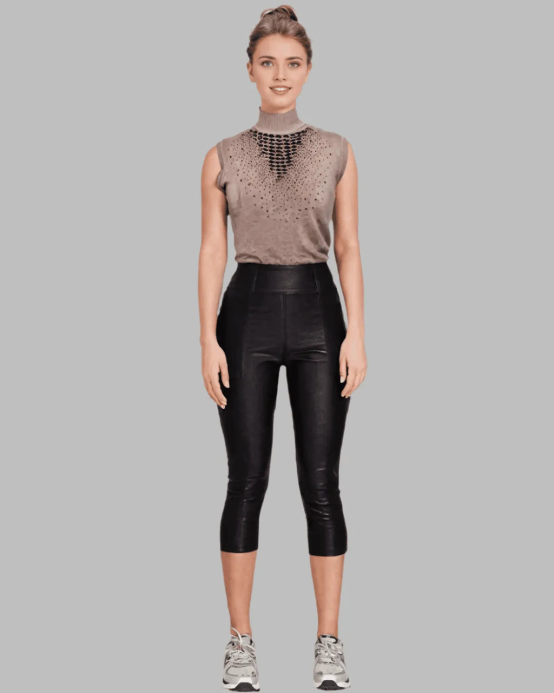 Beige sleeveless turtle neck sweater with embellishment