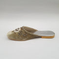 Bejeweled shoe on a gray background