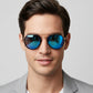 Sunglasses with blue reflective lenses and gold frame on a white background