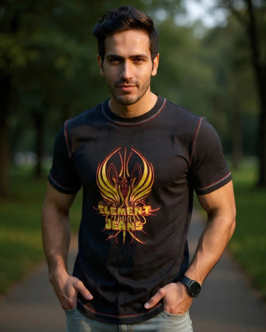 Man wearing a black t-shirt with a logo in an outdoor setting
