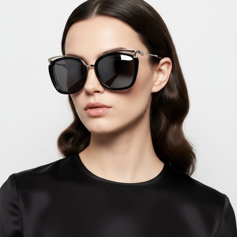 Sunglasses with black frames and reflective lenses on a white background