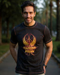 Man wearing a black t-shirt with a colorful logo outdoors