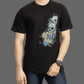 Person wearing a black t-shirt with a graphic design on a gray background
