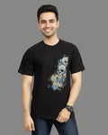 Person wearing a black t-shirt with a graphic design on a gray background