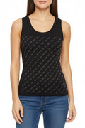 Woman wearing a black tank top with a subtle pattern and blue jeans on a white background