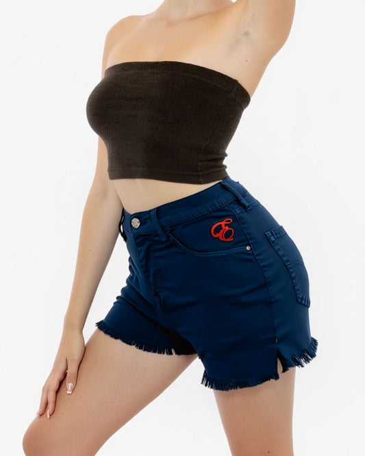 Woman wearing a brown strapless top and blue denim shorts with a red logo on a white background