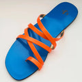 Blue sandal with orange straps on a light gray background