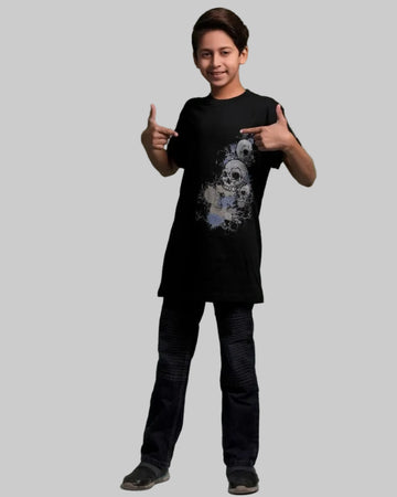 Person wearing a black t-shirt with a graphic design on a green background