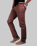 Brown pants worn by a person on a white background