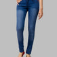 Blue jeans worn by a person on a gray background