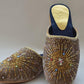 A pair of camel velvet mule shoes with beaded hand embroidery.