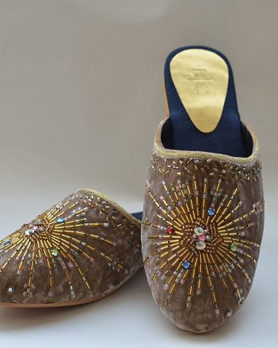 A pair of camel velvet mule shoes with beaded hand embroidery.
