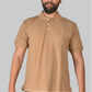 Man wearing a beige polo shirt on a white background