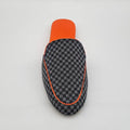 Checkered patterned case with orange accents on a white background