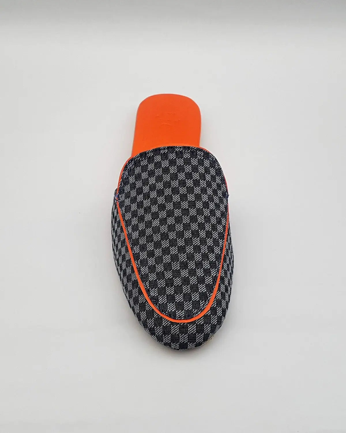 Checkered patterned case with orange accents on a white background