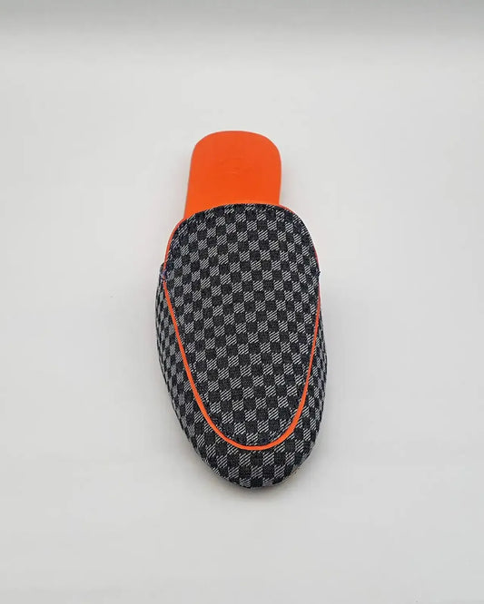 Checkered patterned case with orange accents on a white background