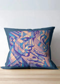 Decorative pillow with abstract face design on a wooden surface