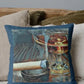 Decorative pillow with a glass of whiskey and a cigar on a couch.