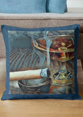 Decorative pillow with a painting of a cocktail and a cigar on a couch.