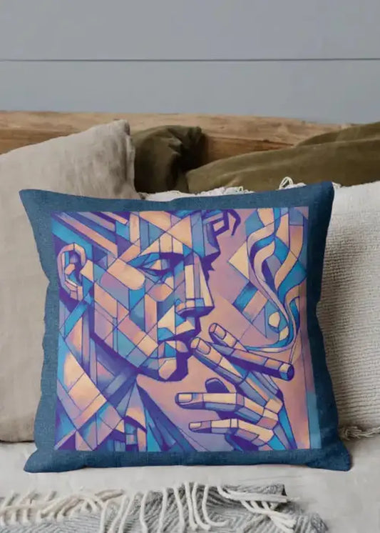 Decorative pillow with abstract face design on a couch