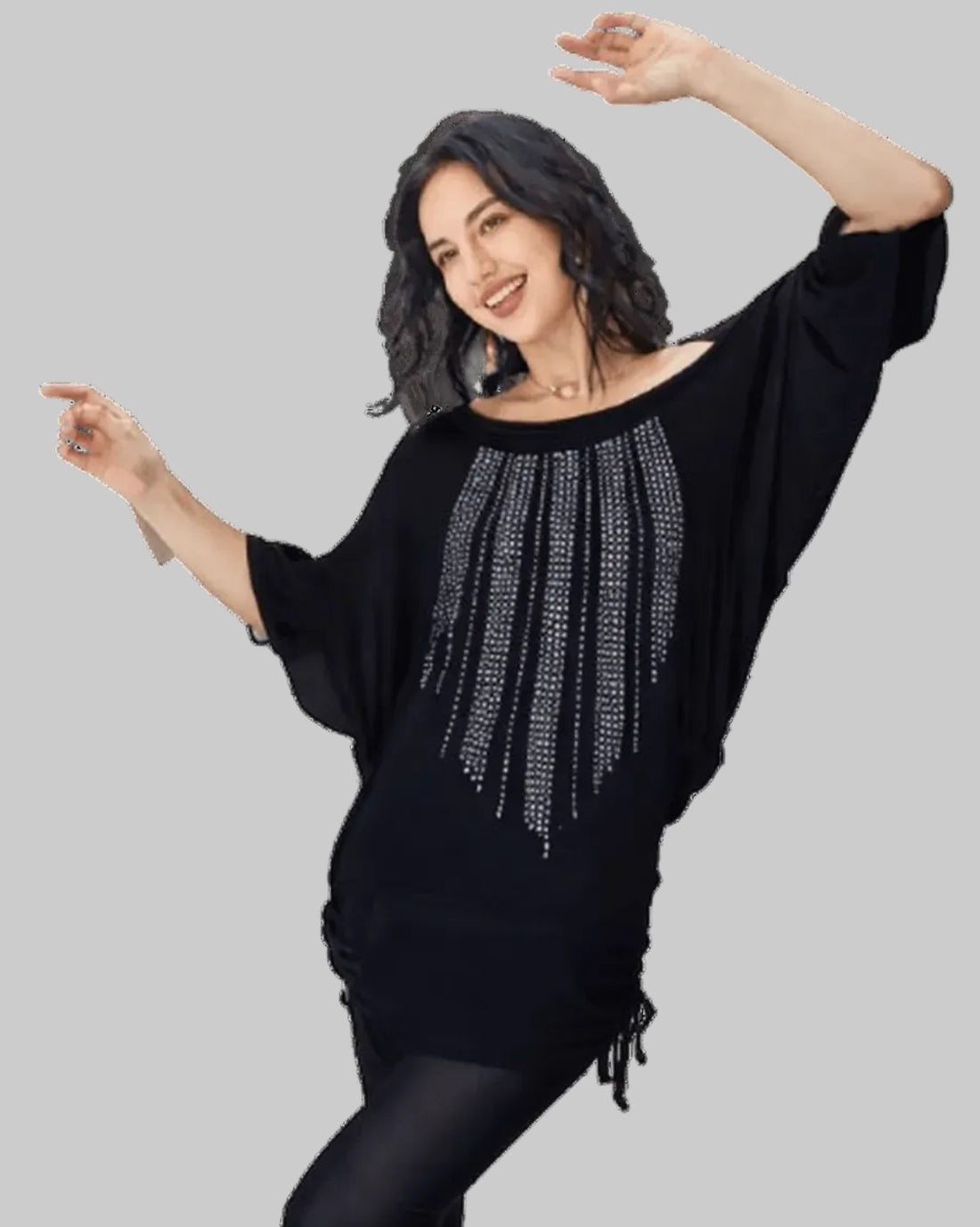 Woman wearing a black sweater with silver embellishments on a white background