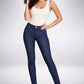 Woman wearing a white tank top and dark blue jeans on a gray background