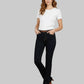 Woman wearing black jeans and a white t-shirt on a gray background