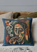 Decorative pillow with a stylized portrait of a man smoking on a couch.