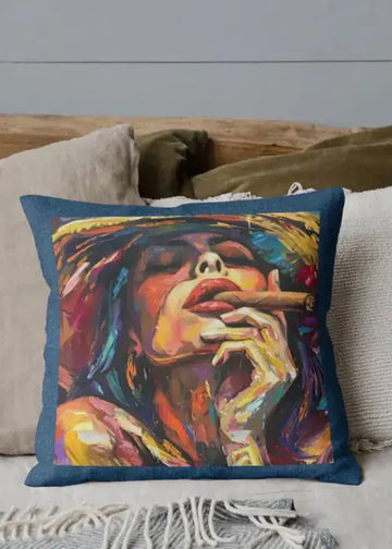 Colorful pillow with a stylized portrait of a person smoking a cigar on a couch.