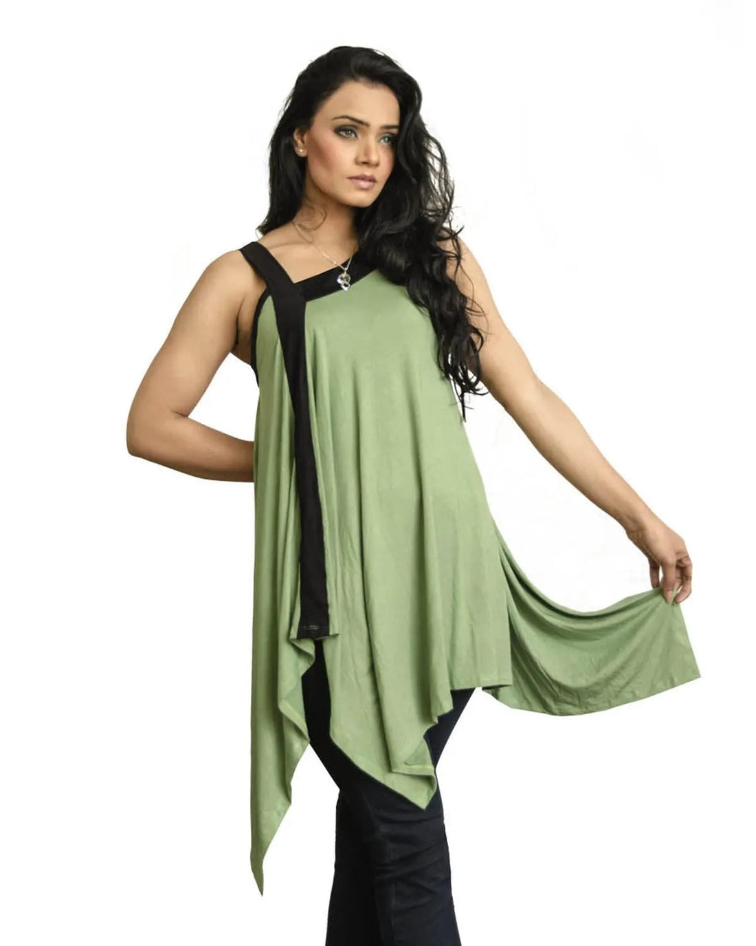Woman wearing a green sleeveless top with black trim on a white background