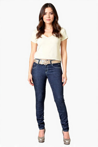 Woman wearing a white t-shirt and blue jeans on a white background