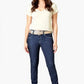 Woman wearing a white t-shirt and blue jeans on a white background