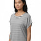 Woman wearing a gray t-shirt with a white and black striped pattern on a white background