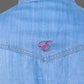 Blue denim shirt with a red embroidered letter 'E' on a white background