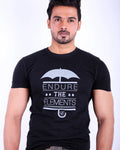 Man wearing a black t-shirt with 'Endure the Elements' graphic on a white background