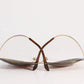 Pair of eyeglasses with gold frame on a white background