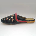 Decorative slipper with embroidery on a white background