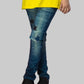 Person wearing blue jeans with star patterns and a yellow top, standing on red and gray blocks.